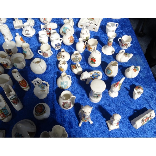 218 - Extensive collection of crested china including Goss, tank, lighthouses, bridge, animals, etc, and a... 