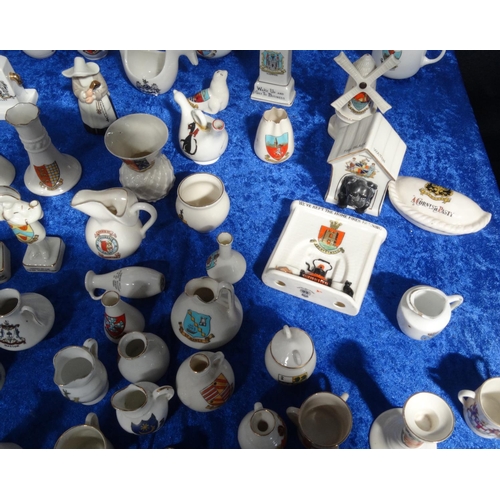 218 - Extensive collection of crested china including Goss, tank, lighthouses, bridge, animals, etc, and a... 