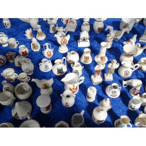 218 - Extensive collection of crested china including Goss, tank, lighthouses, bridge, animals, etc, and a... 