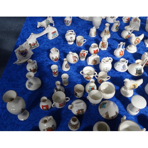 218 - Extensive collection of crested china including Goss, tank, lighthouses, bridge, animals, etc, and a... 