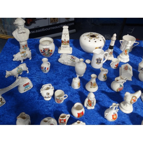 218 - Extensive collection of crested china including Goss, tank, lighthouses, bridge, animals, etc, and a... 