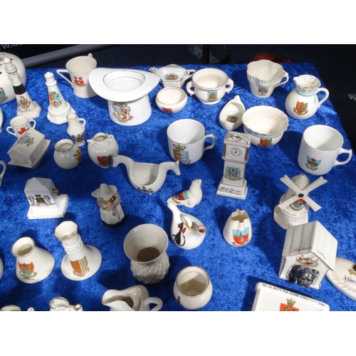 218 - Extensive collection of crested china including Goss, tank, lighthouses, bridge, animals, etc, and a... 