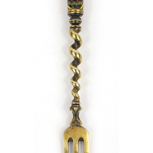 200 - Continental unmarked silver fork the handle enamelled with classical scenes of figures, 17cms long