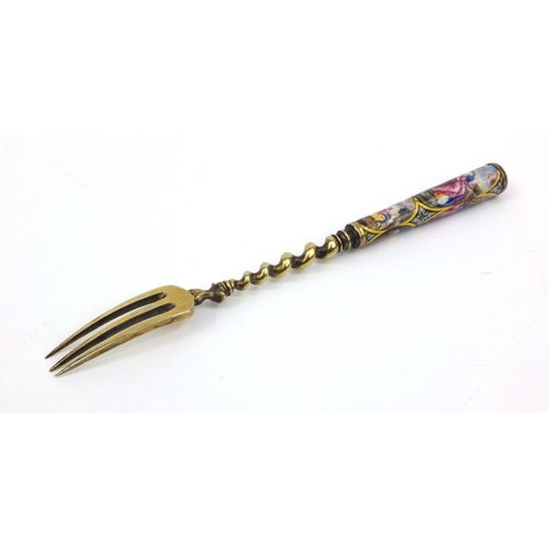 200 - Continental unmarked silver fork the handle enamelled with classical scenes of figures, 17cms long