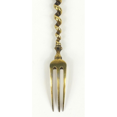 200 - Continental unmarked silver fork the handle enamelled with classical scenes of figures, 17cms long