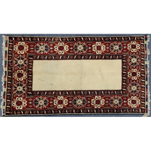 2060 - Rectangular Middle Eastern Qalin rug decorated with a geometric floral border onto a red and cream g... 