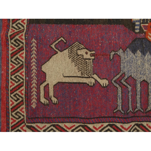 2055 - Rectangular Middle Eastern Qalin rug with geometric border, the central field decorated with two lio... 