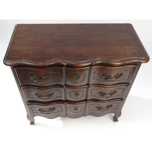 2009 - Carved oak three drawer serpentine chest, 84cm high x 90cm wide x 45cm deep