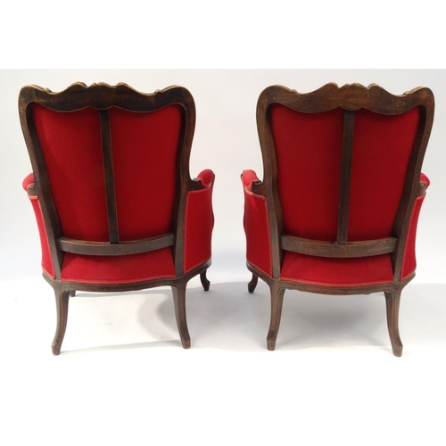 2015 - Pair of French carved walnut armchairs with red upholstery and floral carvings
