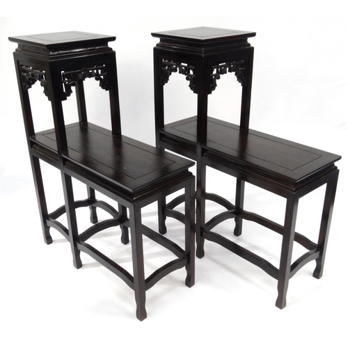 2054 - Pair of oriental Chinese hardwood two tier step stands, 96cm high x 72cm wide x 29cm deep