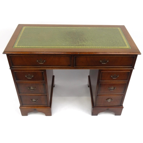2002 - Mahogany twin pedestal desk with tooled leather top fitted with eight drawers, 79cm high x 106cm wid... 