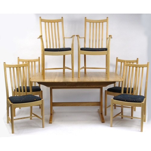 2013 - Ercol elm extending dining table, together with six chairs including two carvers, with blue upholste... 