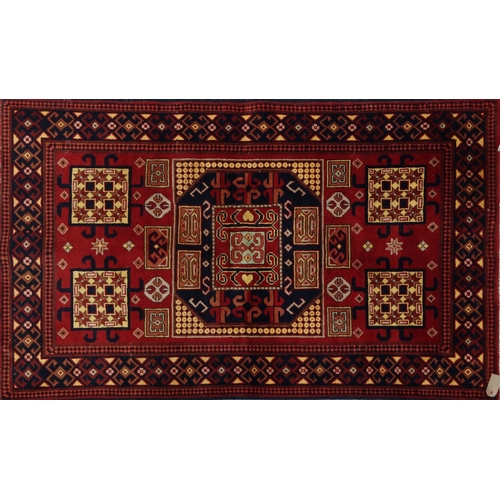 2049 - Rectangular Middle Eastern Qalin rug decorated with geometric shapes onto a red ground, 155cm x 98cm