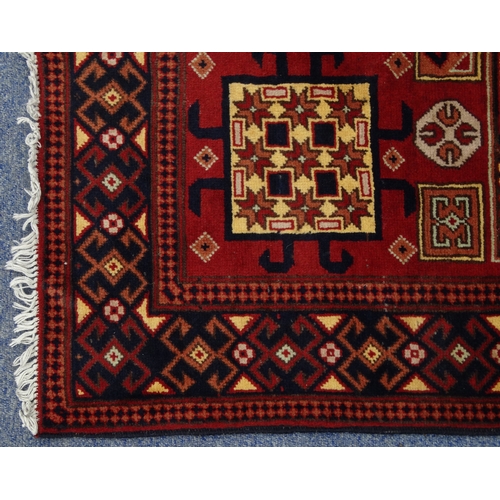 2014 - Rectangular Middle Eastern rug with geometric border, the central field with geometric floral decora... 