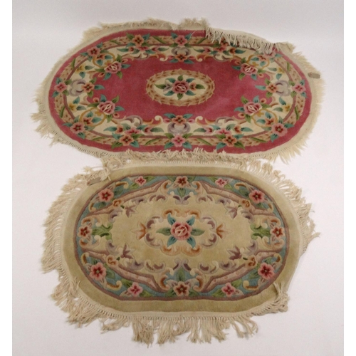25 - Two oval floral rugs, the larger 160cm x 100cm