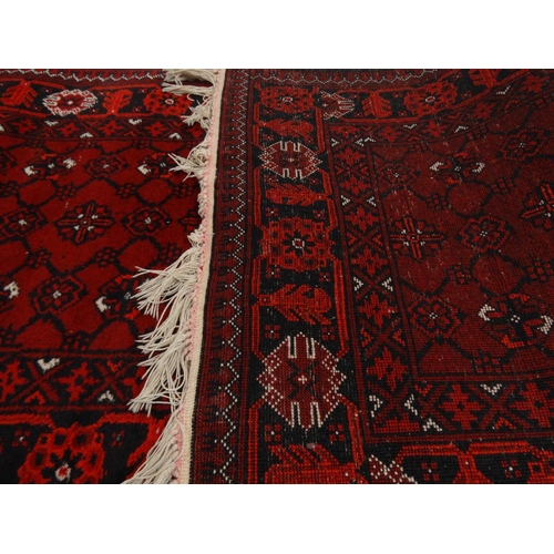 14 - Red ground geometric patterned carpet runner, approximately 300cm x 82cm