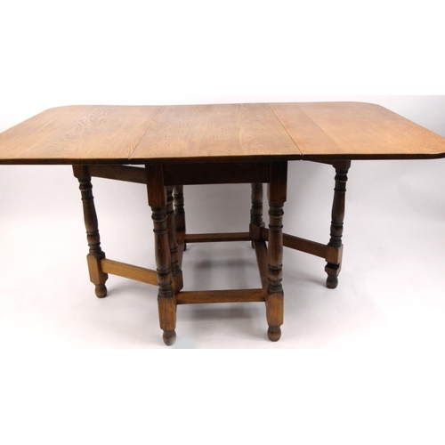 50 - Oak gateleg dining table, 73cm high x 150cm wide when extended x 91cm deep
