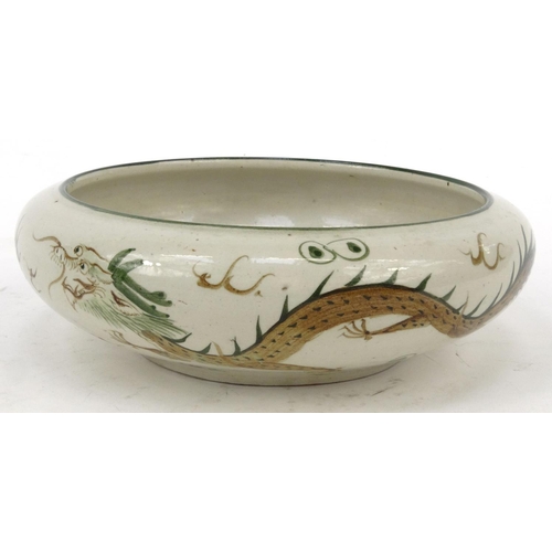 416 - Oriental Chinese stoneware bowl hand painted with a dragon chasing a pearl, 23cm diameter