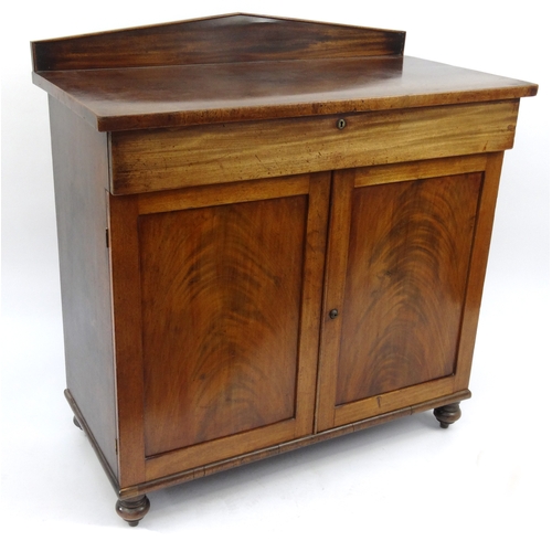 2003 - Victorian mahogany chiffonier with a drawer above two panelled doors, 107cm high x 103cm wide x 51cm... 