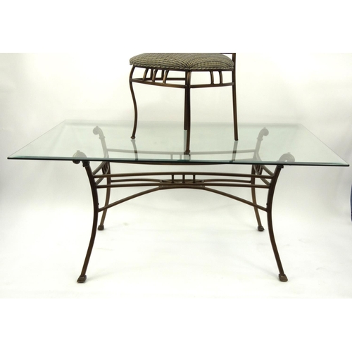 40 - Contemporary bronzed metal dining table with glass top with six chairs, the table 77cm high x 168cm ... 