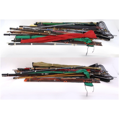 532 - Large selection of mostly sea-fishing rods, together with some landing nets