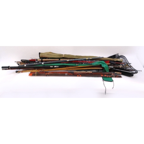 532 - Large selection of mostly sea-fishing rods, together with some landing nets