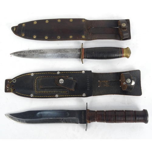 738 - Two military interest hunting knives - one stamped 'Taylor Witness Sheffield', the other numbered 22... 