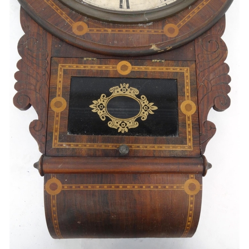 264 - Inlaid wall hanging clock with Waterbury Clock Co label to the interior, 70cm long