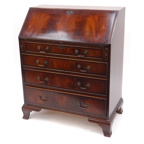 22 - Flame mahogany bureau fitted with a fall above four drawers