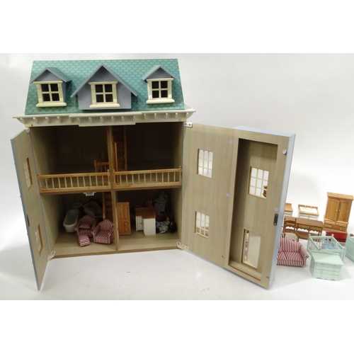 252 - Large wooden dolls house with furniture