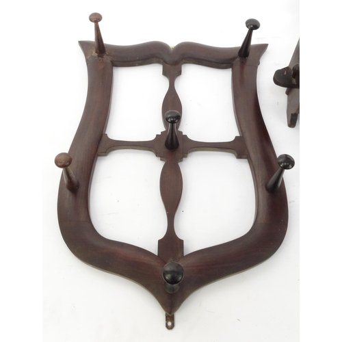 102 - Victorian mahogany shield shaped coat hanger and a set of open shelves