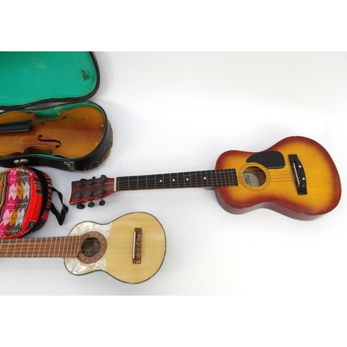 162 - Cased wooden violin, First Act child's guitar and a Charango