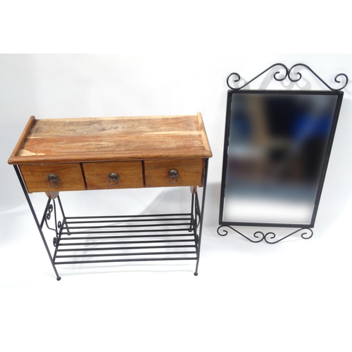 68 - Mexican pine wrought iron hall table fitted with three drawers with a wrought iron framed wall mirro... 