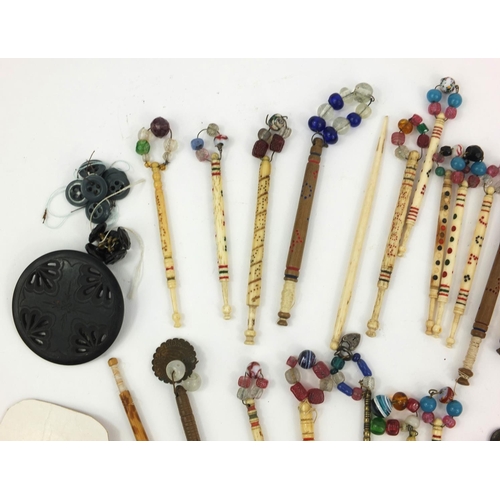 99 - Selection of Victorian bone lace bobbins, together with some antique buttons