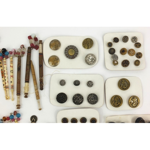 99 - Selection of Victorian bone lace bobbins, together with some antique buttons