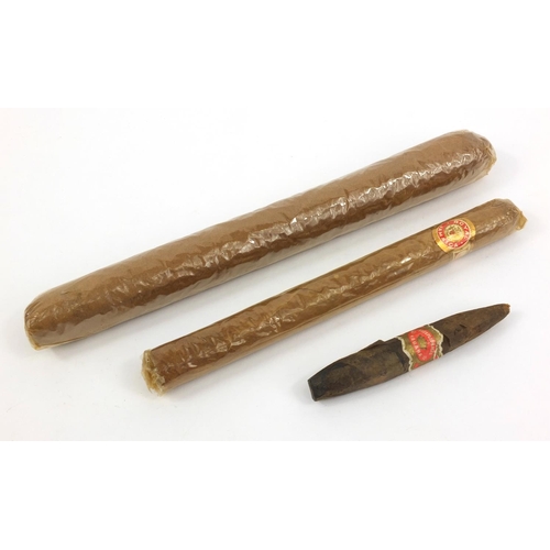 127 - Large Churchill type cigar, Royal Jamaica cigar and a lead dummy cigar, the largest 26cm long