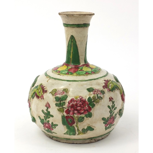 586 - Oriental Chinese pottery bottle vase with relief phoenix and floral decoration, 22cm high