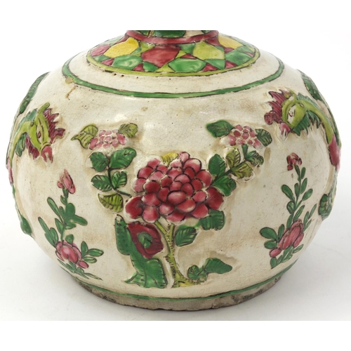 586 - Oriental Chinese pottery bottle vase with relief phoenix and floral decoration, 22cm high