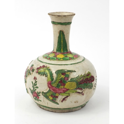 586 - Oriental Chinese pottery bottle vase with relief phoenix and floral decoration, 22cm high