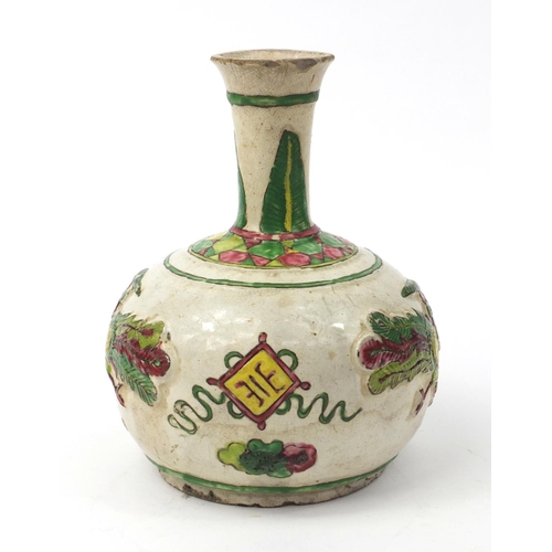 586 - Oriental Chinese pottery bottle vase with relief phoenix and floral decoration, 22cm high