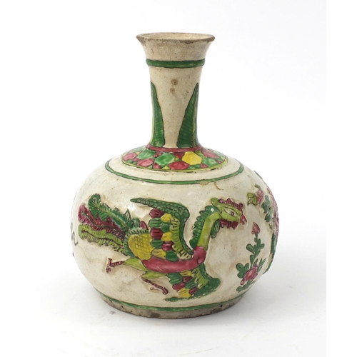 586 - Oriental Chinese pottery bottle vase with relief phoenix and floral decoration, 22cm high