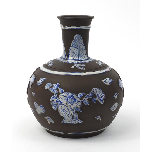 587 - Oriental Chinese Yixing terracotta bottle vase with relief phoenix and floral decoration, 21cm high