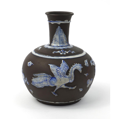 587 - Oriental Chinese Yixing terracotta bottle vase with relief phoenix and floral decoration, 21cm high