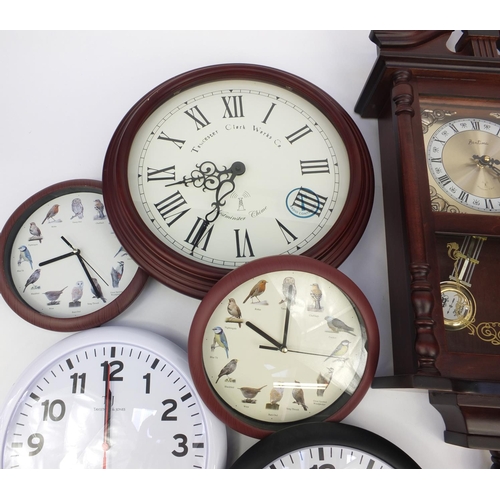 215 - Collection of decorative wall clocks, brass mantel clock and a ship's design clock