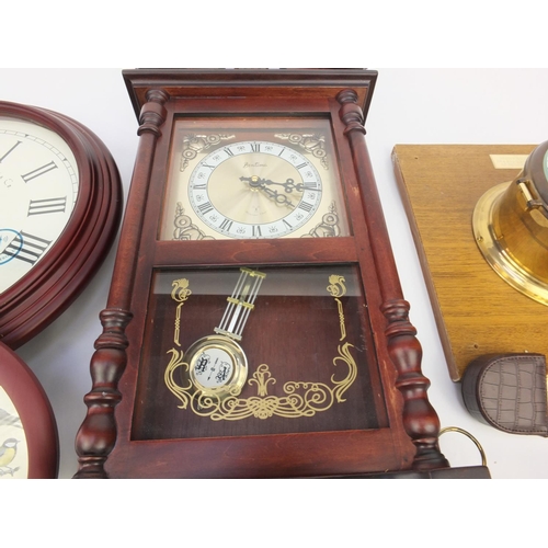 215 - Collection of decorative wall clocks, brass mantel clock and a ship's design clock