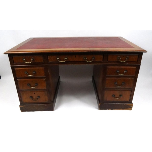 4 - Oak twin pedestal desk with red leather top and fitted with nine drawers, 75cm high x 136cm wide x 7... 