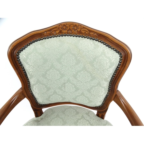 96 - Carved mahogany bedroom chair with green floral upholstery