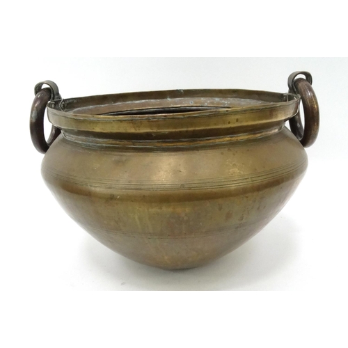 255 - Large brass vessel with ring handles, 40cm diameter