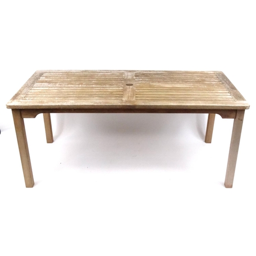 131 - Rectangular teak garden table, approximately 74cm high x 175cm wide x 86cm deep