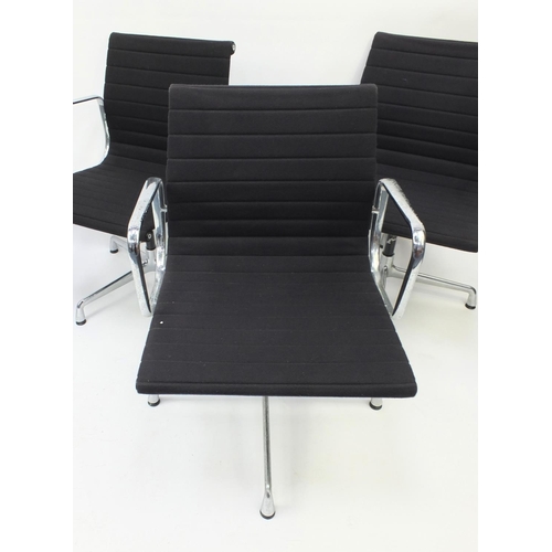 43 - Set of four Vitra Charles & Ray Eames EA108 swivel chairs with chrome frames and black hopsack uphol... 